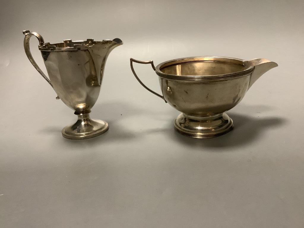 Two George V silver cream jugs and two similar silver sugar bowls